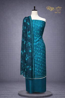 MURASHE Rijja RM-143 Premium Unstitched Lawn Suit with intricate embroidery and vibrant fabric in a detailed close-up image.